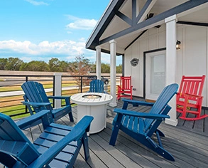 chairs around fire pit on deck