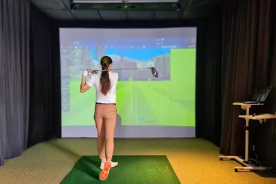 woman using a golf simulator